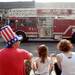 Rob Steiner, his daughter Amelia, 7, and wife Sarah, all of Ann Arbor, watch the start of the 23rd Annual Ann Arbor Jaycees Fourth of July Parade  from the sidewalk along South State St. on Thursday, July 4, 2013 on South State Street in downtown Ann Arbor. Melanie Maxwell | AnnArbor.com
